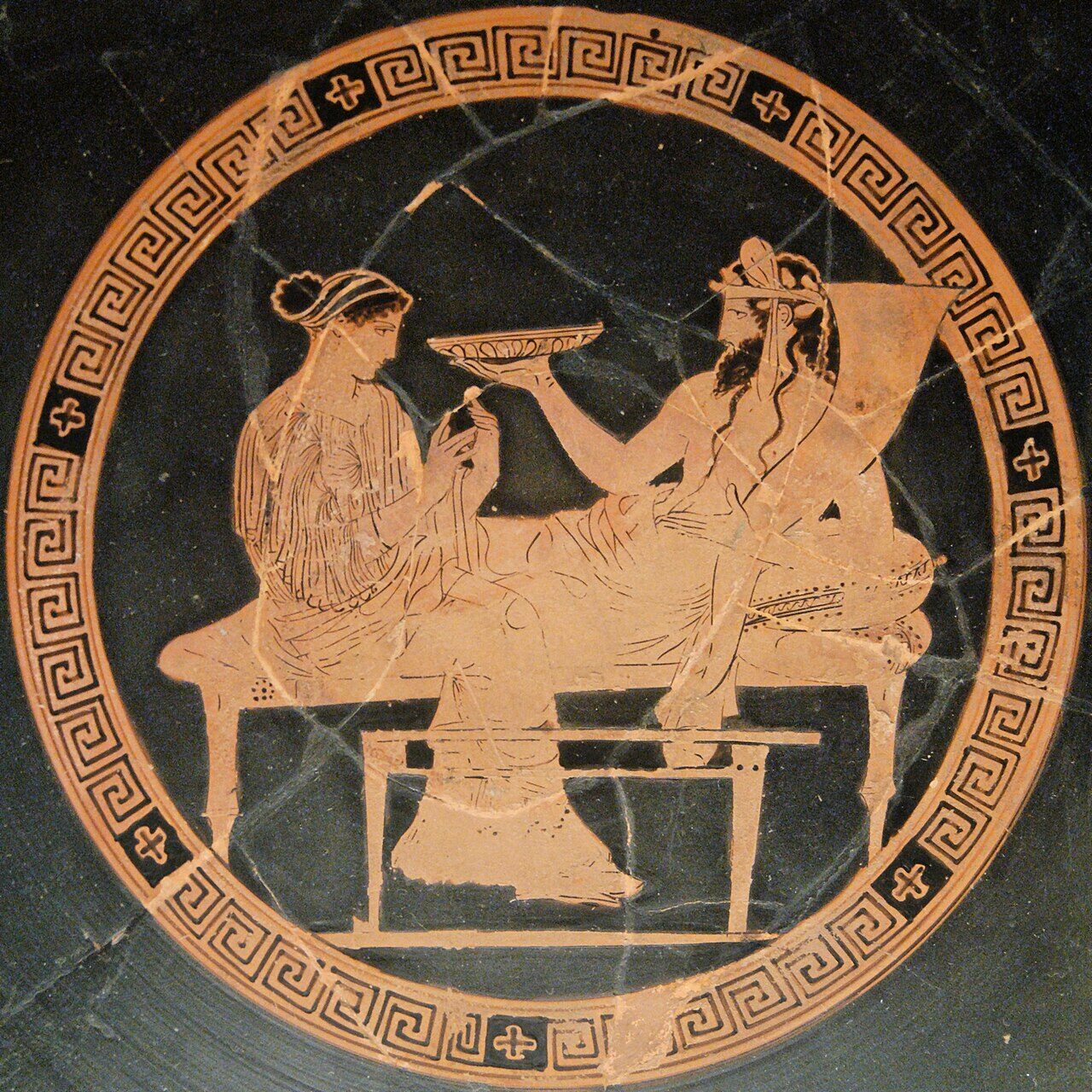 Attic red-figure kylix showing Persephone seated beside Hades